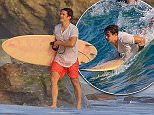 Orlando Bloom fighting the California heat wave with a day of surfing on friday showing off his skills.jpg
